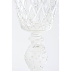 a clear glass vase sitting on top of a table