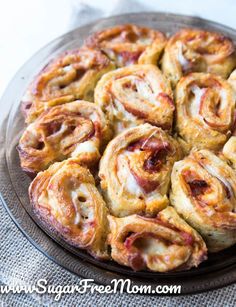 a plate filled with pastries sitting on top of a table