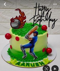 a birthday cake with a photo of a man holding a baseball bat and ball on it