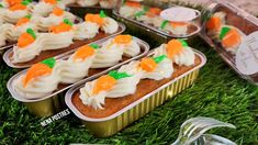 several tins filled with carrot cake on top of green grass