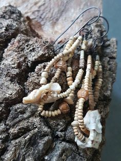 several pieces of jewelry sitting on top of a rock