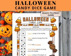 halloween candy dice game with pumpkins on the table