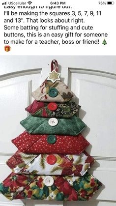 a christmas tree made out of fabric and buttons