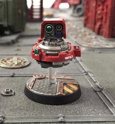 a close up of a toy robot on a table