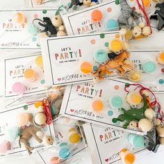 many different types of buttons and tags on a white surface with text that reads let's party