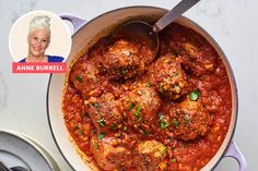 a pot filled with meatballs covered in sauce and garnished with parsley