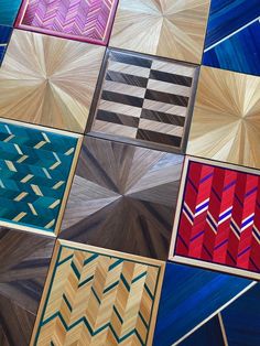 many different colored squares are arranged in the same pattern as they appear to be made out of wood