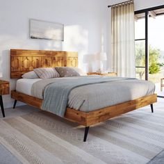 a bedroom with a bed and two nightstands