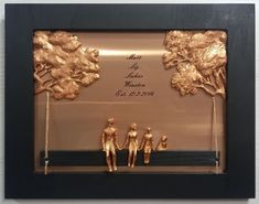 two people are holding hands in front of a gold foiled plaque with the words, may you be loved by someone else