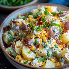 a bowl filled with potato salad on top of a table