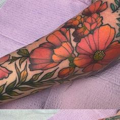 two pictures of flowers on the arm and leg