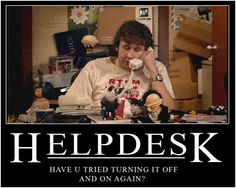 a man sitting at a desk talking on a phone with the caption helpdesk have u tried turning it off and on again?