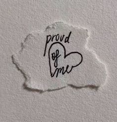 a torn piece of paper with the words proud of me written on it and a heart