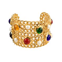 A beautiful gold plated cuff, fashioned in signature "Chanel Chain". The cuff features multi-colored bezel set glass stones and pearls and is stamped and marked Chanel. Chanel Cuff, Chanel Brooch, Chanel Chain, Y2k Jewelry, Fall 24, Hand Bracelet, Gold Bracelet Cuff, Chanel Vintage, Chanel Jewelry