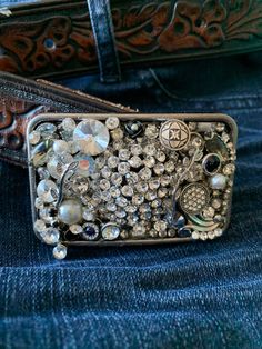 a belt with lots of buttons and beads on the back of it's belt