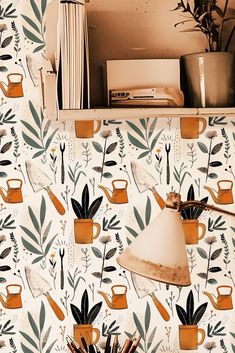 the wallpaper is decorated with plants and watering cans