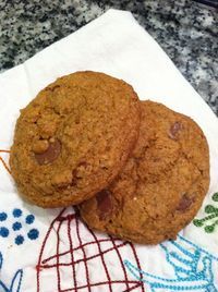 two cookies sitting on top of a white towel