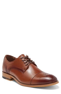 Burnished and brogue details define a cap toe derby that is created with smooth leather. Round cap toe Brogue details Burnished details Lace-up Leather upper, manmade sole Imported Fitted Cap Toe Derby For Semi-formal Occasions, Cap Toe Oxfords For Derby, Fitted Cap Toe Oxfords For Derby, Fitted Derby Shoes With Brogue Detailing And Plain Toe, Fitted Derby Shoes With Brogue Detailing, Fitted Derby With Rubber Heel Cap And Cap Toe, Fitted Cap Toe Derby With Rubber Heel Cap, Cognac Oxfords With Brogue Detailing Cap Toe, Cognac Cap Toe Oxfords With Brogue Detailing