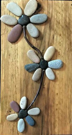 a wooden table topped with lots of stones