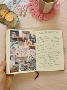 an open book sitting on top of a table next to a cup and saucer