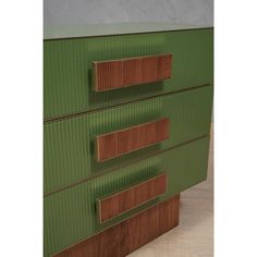 a green and brown dresser with three drawers