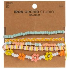 the iron orchid studio bracelets are set in three different colors and sizes, with flowers on