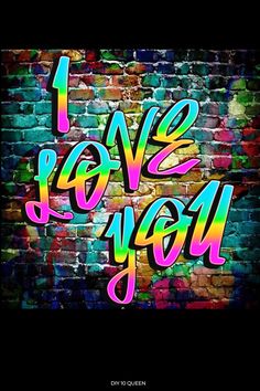 the words i love you are painted on a brick wall in rainbows and blues