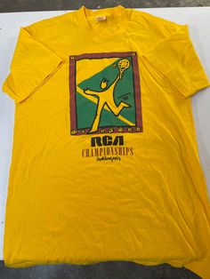 Vintage 90s RCA Tennis Championships Indianapolis T-Shirt Size Large, may fit more like Medium, but see pics for measurements Made in USA Excellent Condition (EUC) Fast Shipping. We ship same or next day with USPS We are a small family business and we appreciate your purchase, Godspeed! ES 90s Crew Neck Shirt With Screen Print, Vintage Yellow Crew Neck Shirt, 90s Yellow Screen Print Tops, 90s Style Yellow Crew Neck T-shirt, God Speed, Racquet Club, Tennis Championships, Brand Ideas, Vintage Tennis