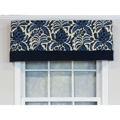 a blue and white window valance with black trim