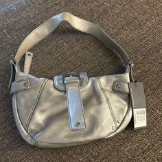 Nwt Kenneth Cole Reaction Kcp Style #:Hr503389mt Silver Metallic Small Hobo Shoulder Bag. See Photos For Details. Casual Hobo Bag With Metal Hardware, Casual Everyday Shoulder Bag With Silver-tone Hardware, Casual Rectangular Shoulder Bag With Branded Hardware, Casual Rectangular Satchel With Silver-tone Hardware, Casual Satchel With Silver-tone Hardware, Casual Crossbody Satchel With Silver-tone Hardware, Casual Satchel Shoulder Bag With Silver-tone Hardware, Casual Shoulder Bag With Silver-tone Hardware For Daily Use, Casual Satchel With Branded Hardware For Daily Use