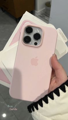 a person holding an iphone case in their hand with the cover on it's back