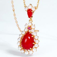 Style: Women Metal: S925 Sterling Silver Plated 18K Gold Pearl Type: Uncultured Pearl Color: White Pearl Size: 2-2.2mm Red Corundum: 3*3mm Red Coral: 10*7mm Silver Weight: 1.51g Luxury Red Pear-shaped Jewelry, Red Pearl Pendant Jewelry Gift, Red Pearl Pendant Jewelry For Gift, Red Drop Jewelry For Gift, Red Drop-shaped Jewelry For Gift, Classic Red Pear-shaped Jewelry, Red Ruby Drop Jewelry, Red Ruby Cabochon Necklace, Red Elegant Jewelry With Pearl Pendant