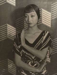 black and white photograph of a woman with her hands folded in front of her chest