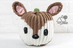 a crocheted stuffed animal with ears on it's head