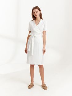 "BRIGITTE is a short sleeve linen wrap dress. DETAILS - True wrap closure - A-line style skirt - Above elbow sleeves - Knee length - 100% lightweight European linen fabric - Cut and sewn to order just for you in our studio COLOR - White, you can also choose other colors above - Fabric samples are available here https://www.etsy.com/listing/586569696/linen-fabric-samples SIZING & FIT - Fits true to size - Bust is approximately 35 inches / 88 cm - Length is approximately 42 inches / 106.5 cm - Fitted Belted Short Sleeve Wrap Dress, Fitted Belted Wrap Dress With Short Sleeves, Elegant Short Sleeve Wrap Dress For Daywear, White Linen Short Sleeve Dress For Work, Knee-length Belted Fitted Linen Dress, Linen Dress With Tie Waist And Short Sleeves, Fitted Belted Linen Dress, Fitted Linen Dress With Short Sleeves For Work, Fitted Short Sleeve Linen Dress For Work