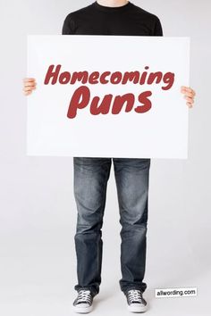 a person holding a sign that says, home coming puns