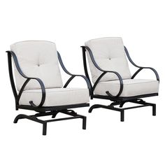 two white chairs sitting next to each other