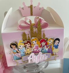 there is a pink box with princesses on it and the name ajja in front