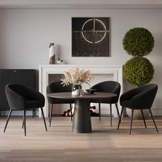 a dining room table with four chairs around it