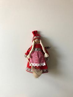 the doll is hanging on the wall