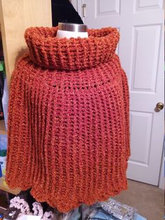 "Crocheted caplet, poncho...by me. I have just finished this winter accessory to keep you warm. It is crocheted in a textured stitch pattern with  yarn of burnt orange color. On my device the color is shown best in the 4th and 5th  picture. This piece has a total length of 28\", about 10\" of those 28\" are a generous turtle neck or cowl. The scalloped buttom edge, is approximately 33\" wide and has stretch. I would suggest sizes M to 2X. This is a warm winter poncho for many occasions. Other co Crochet Caplet, Winter Poncho, Ladies Poncho, Shoulder Wrap, Burnt Orange Color, Yarn Sizes, Poncho Cape, Winter Accessories, Burnt Orange