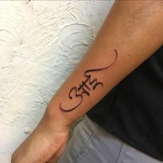 a person with a tattoo on their arm