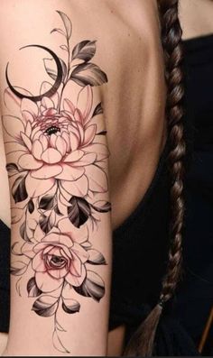 a woman's arm with flowers on it