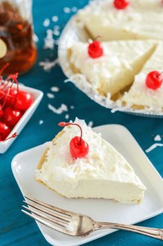 there is a piece of cake with cherries on it and a fork next to it