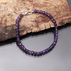 "Product Details : Item Code : DGC4216 Gemstone Name : AMETHYST Chain Style : BEADED Beads Shape : FACETED SQUARE CUBE BOX Beads Size : 5 mm Approx. Length : 8\" Inch Approx. Weight : 40 Cts. Approx. Customization : **Available** Please Feel Free To Contact If You Have Any Query." Spiritual Amethyst Bracelets With Polished Beads, Adjustable Purple Rondelle Beaded Bracelets, Adjustable Amethyst Rondelle Beaded Bracelets, Amethyst Round Beads Polished Bracelets, Rondelle Amethyst Natural Stones Beaded Bracelets, Rondelle Amethyst Beaded Bracelets With Natural Stones, Faceted Purple Beaded Bracelets As Gift, Amethyst Faceted Beads Bracelet, Faceted Amethyst Beaded Bracelets As A Gift