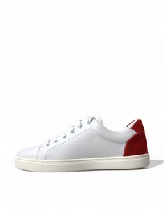 Step into luxury with these exquisite low-top sneakers from Dolce & Gabbana. Crafted in Italy, these shoes boast high craftsmanship with a sleek white leather exterior and bold red detailing. The classic lace-up design is complemented by a crisp white sole, featuring the brand’s iconic logo. Perfect for adding a touch of elegance to any casual look. Color: White, red Material: 100% Leather Sole: Rubber Country of origin: Italy Logo details Luxury Low-top Sneakers With Red Sole, Luxury Classic Sneakers With Red Sole, Italy Logo, Haute Couture Brands, Chic Sneakers, Formal Loafers, White Leather Sneakers, Chic Leather, Dolce E Gabbana