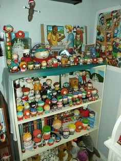 a shelf filled with lots of different types of toys and knick - knacks