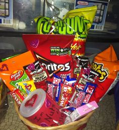 a basket filled with candy and snacks