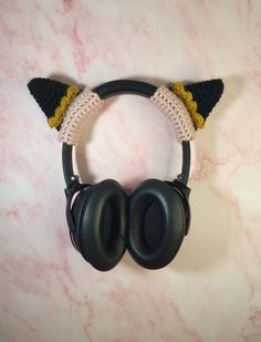 a pair of black headphones with cat ears