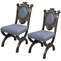 two chairs with blue and white patterned upholstered backrests are facing each other